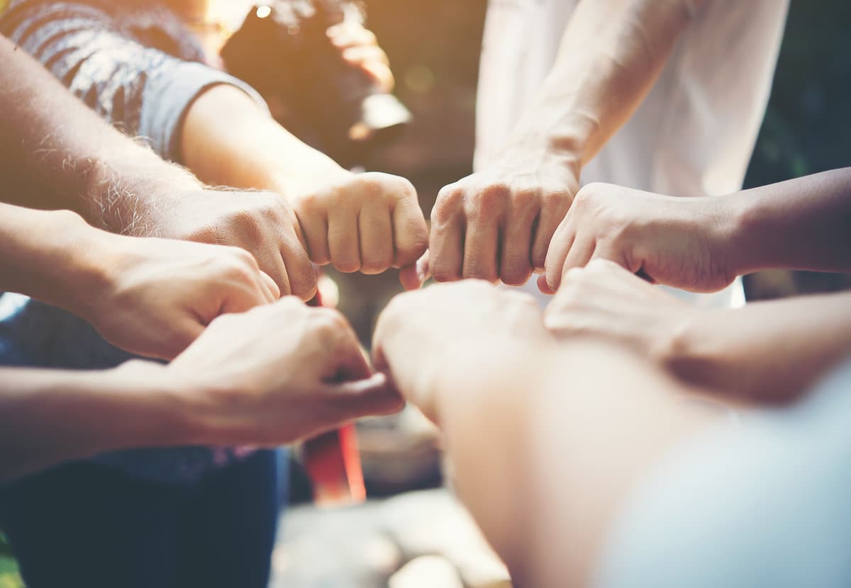People joining their hands together